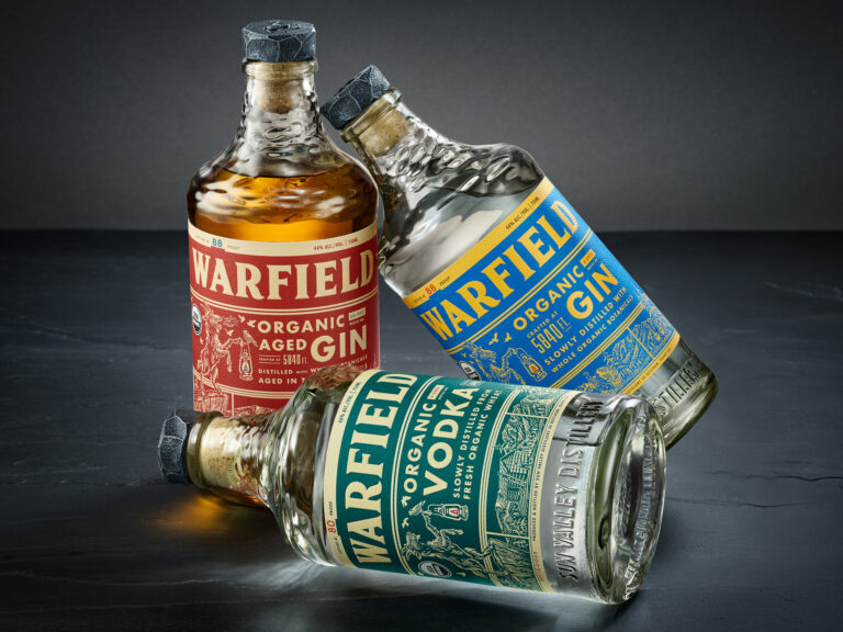 Warfield Gin, Vodka, and Aged Gin bottle packaging design by Chad Michael Studio featuring bespoke textured glass and mountain-inspired branding