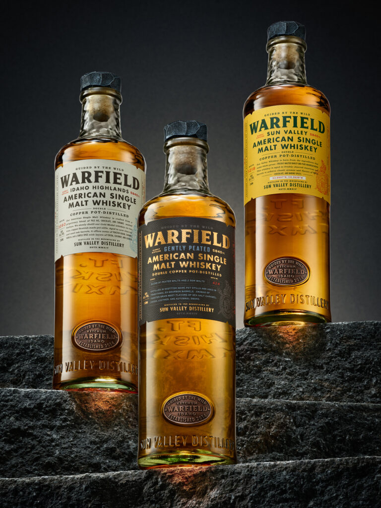 Warfield Whiskies monumental bottle packaging design by Chad Michael Studio featuring bespoke textured glass and mountain-inspired branding
